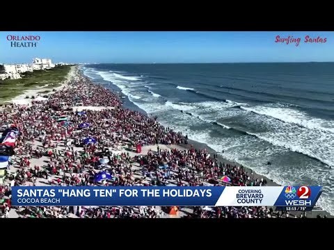 Hundreds of Santas take over Cocoa Beach in annual surfing event