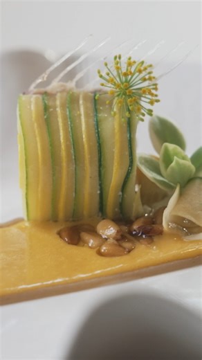 We bet you’ve never seen a Dover sole tomahawk before. 🐟 At Michelin-starred Esmé in Chicago, they’re giving fish the rack of lamb treatment. The intricate process involves wrapping a filet of Dover sole with ribbons of zucchini, which is served with sea buckthorn and banana, making for one delicate and flavorful bite. | Eater