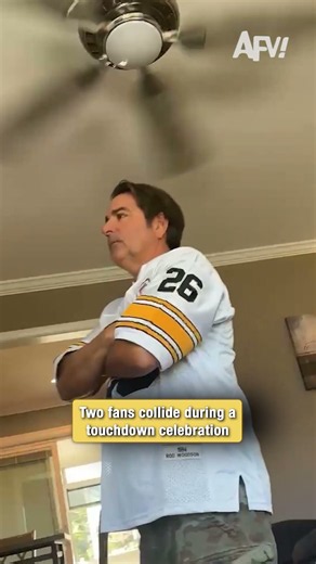 Two fans collide during a touchdown celebration 🏈