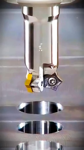 Must-Try Indexable Chamfer Mill 🔥 These cutters carry star-shaped (pentagonal) double-sided inserts with 10 cutting edges - 5 intended for front chamfering and 5 for back chamfering. 🎥 ISCAR #cncmachine #cncmachining #machinist #machining #cncmilling | CloudNC