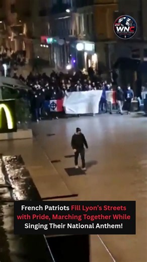 French Patriots March Through Lyon Singing Anthem, Showcasing National Pride and Unity