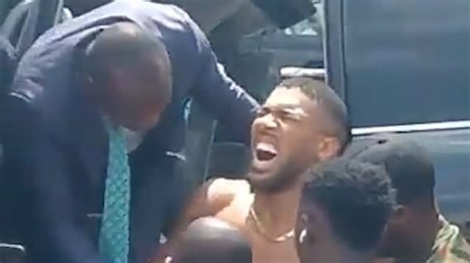 Anthony Joshua in visible pain as he is lifted from car after crash in Nigeria