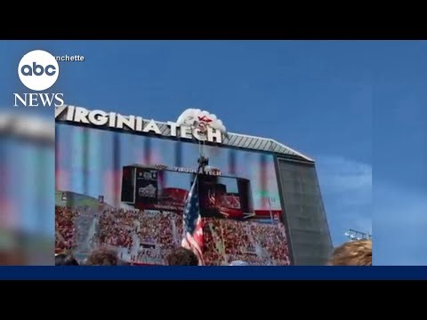 Skydiver slams into Virginia Tech scoreboard, dangles by parachute