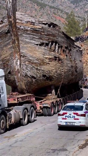 🚨 BREAKING: THEY JUST FOUND NOAH'S ARK AND IT'S BEING MOVED WITH POLICE ESCORT 🚨 Stop scrolling. Look at what you’re seeing. That is NOT a movie set. That is a 3000-year-old wooden ship, bigger than 2 trucks, being transported on a 100-wheel trailer through the mountains of TURKEY. And the police are escorting it. Hundreds of people came to watch. Why? Because locals are saying this IS Noah’s Ark. For years, people have claimed that Noah’s Ark is buried under ice on Mount Ararat in Turkey. The