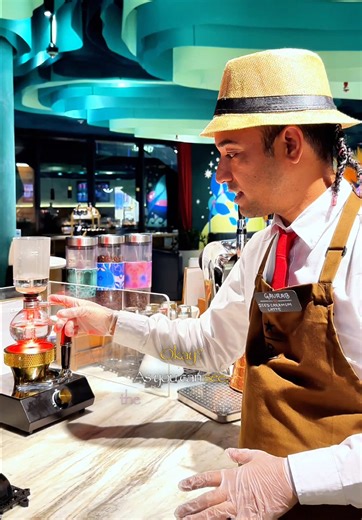 Coffee as Science: The Siphon Brewing Method Explained We explore the fascinating world of coffee brewing through science using a siphon device. We demonstrate how this vacuum pot works, explain its components including the borosilicate glass chambers, and walk through the entire brewing process step-by-step. We show how water is heated and rises through vacuum pressure, how to properly add ground coffee, and the techniques for achieving the perfect brew indicated by a dome-shaped crust. Finally