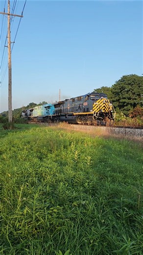 Distant thunder storm and an all Wabtec locomotive test set on the Erie plant test track. 912026