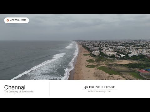 Aerial view of Marina Beach coastline with waves and urban development | CHENNAI 4K Drone Footage