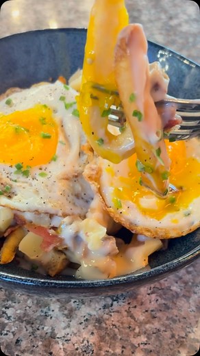 Alfred Poutine!!! 襤 This epic dish features sunny-side up eggs, golden French fries, rich sausage gravy, gooey cheese curds, and crunchy bacon. | Terra Cotta Bistro & Bakery | Facebook
