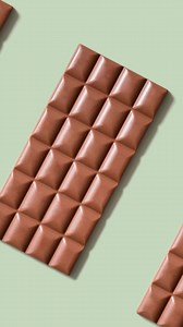 Animated chocolate bar pattern. World Chocolate Day concept. High quality footage