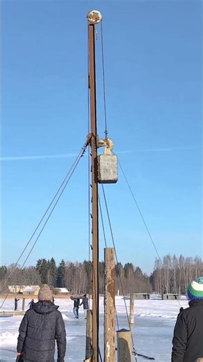 Driving Wooden Piles Through Ice | Homemade Pile Driver in Action