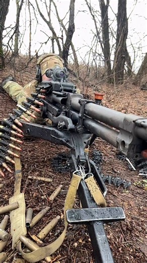 Close-range footage of a KORD 12.7mm heavy machine gun in action, capturing the raw intensity of frontline combat. The recoil, the thunderous sound, and the cascade of spent casings reveal the sheer power behind this weapon system in real-time.