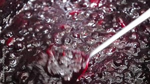 Making homemade jam : Boil the aronia, peach, sugar and lemon juice. Aronia is a superfood, also called chokeberry or king's berry.