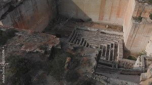 drone footage of Lithica Ciutadella in menorca spain tilting down the historic labyrinth