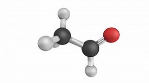 Acetaldehyde (ethanal) molecule, chemical structure. Acetaldehyde is a toxic molecule responsible for many symptoms of alcohol hangover. Atoms are represented as spheres with conventional color coding