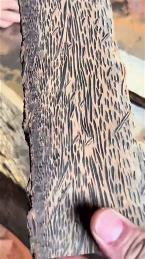 smoothing and leveling coconut wood blocks with power planer to reveal the unique dark grain pattern