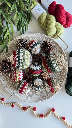 Michelle Moore on Instagram: "🎉 Our Holiday Weave Baubles are now live on our Blog & YouTube Channel! ✨✨ Comment **HHBAUBLE** for a free tutorial! This quick and easy Moss stitch pattern will make your tree extra special and is also perfect for gifting! 🎄💖 #HolidayCrafts #MossStitch #FreeTutorial #HandmadeHolidays #ChristmasDecor #CraftyChristmas #crochrtornament #crochetbauble"