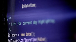 Download PHP-code review on screen by web developer and php developer shows computer screen with source code of website and server scripts for modern applications in secure object oriented programming language for free