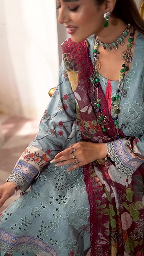 "SUNSHINE BLOOM - Embroidered Cutwork Edition" by ALZOHAIB. This dramatic article radiates a fusion of contemporary patterns with traditional chikankari details in vivid hues. Paired with a contrast cutwork dupatta and matching bottom. COMING SOON.. #ALZOHAIB #SunshineBloom #embroideredcutwork #printedcambric #midsummercollection2023 #dailywear #comingsoon | Asian Lifestyle Magazine