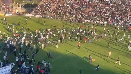 Bosso fans rush into the pitch to celebrate after Highlanders beat Scottland 2-1 on penalties at Barbourfields Stadium this afternoon. The match had ended 2-2 in regulation time. Bosso advance to the semi-finals of the Chibuku Super Cup | B-Metro