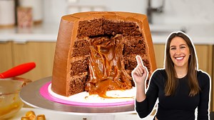 This candy-inspired cake looks and tastes just like a Rolo with layers of chocolate cake and a homemade caramel filling. Get the recipe here: https://chelsweets.com/rolo-cake/ | Chelsweets