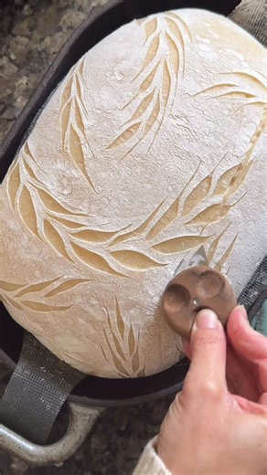Kathryn Shields on Instagram: "People always ask if I do a mid-bake expansion score. I do, but only in very specific situations: 1️⃣ When the dough is severely overproofed. If I scored it before baking, it would collapse instantly. A mid-bake cut helps control the spread without deflating the loaf. 2️⃣ When I’m doing a very intricate design. If I want to preserve the detail or create a 3D-style loaf, I’ll wait and open it up mid-bake. Outside of those two scenarios, I don’t use a mid-bake score.
