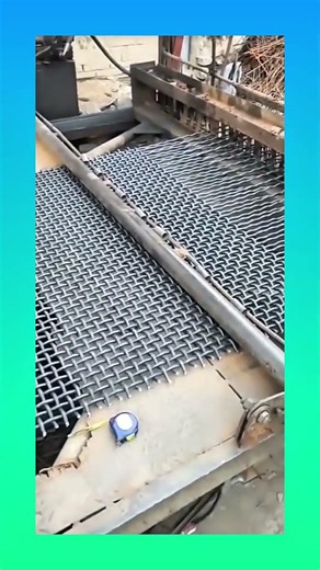 A machine weaving metal rods into interlaced patterns, forming strong and structured steel designs.