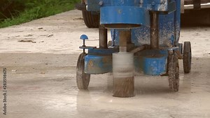 Closeup of a machine core drilling a hole in concrete on a construction site