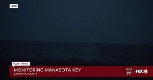 Watching waves on Manasota Key in Tuesday's storm