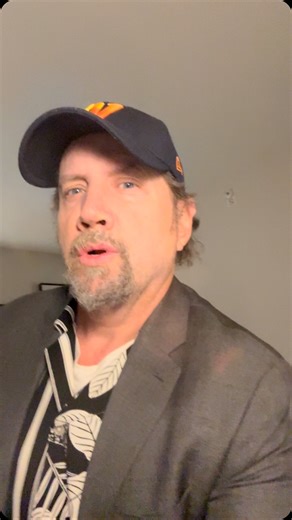 In a suit. | Jamie Kennedy