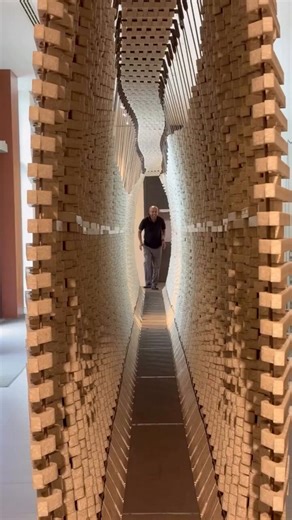 A Greek engineer built a wall that shifts tons of steel the instant you step on it. Your body weight alone pushes it open about 5 feet around you as you walk. There are no electronics anywhere inside. It runs on hidden steel springs and recycled plastic.Her name is Nassia Inglessis. She studied engineering at Oxford, then art at the Royal College of Art in London, then did research at MIT with the designer Neri Oxman. In 2014 she set up her own studio, Studio INI, in the basement of Somerset Hou