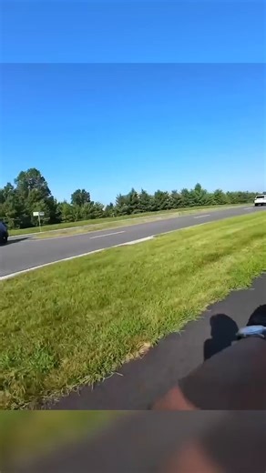 Cop drives through the grass to pull over bikers