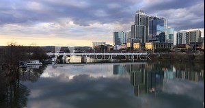 Austin Texas city skyline over river bridge sunset. Ann W. Richards Congress Avenue Bridge cross Lady Bird Lake, Town Lake is a river reservoir on Colorado River in Austin, Texas.