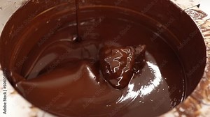 Melted chocolate in a tempering machine. Artisan bean to bar chocolate making process. Chocolate tempering in a chocolate factory. Stock Video