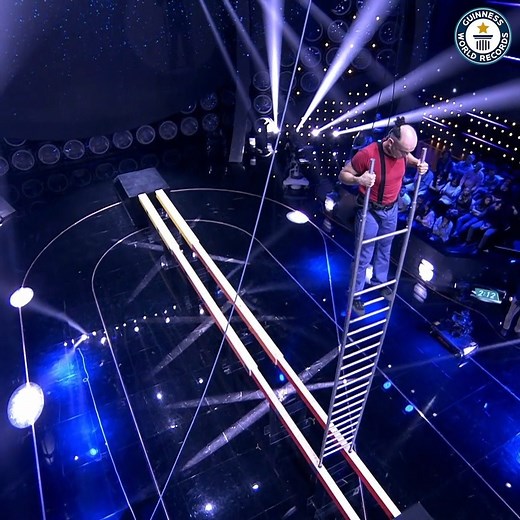 1.1M views · 3.4K reactions | Can Italy's Milo Scotton make it across the parallel beams balanced on a ladder? | Guinness World Records | Facebook