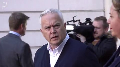 Huw Edwards leaves court after being spared jail time