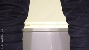 Man going to use a toilet