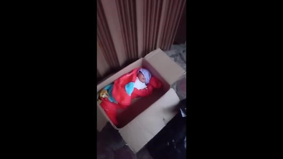 Abandoned baby found in cardboard box in Indonesia