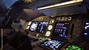 Detail of 747 pilot's hand adjusting instruments in the cockpit of a jumbo jet. Short clip, originally recorded in 4K.