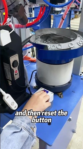 Automatic eyelet punching machine with alarm system