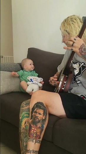 Banjo lesson for Baby Shiloh