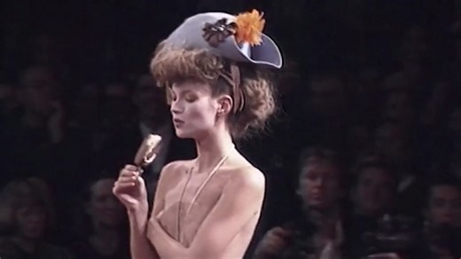 One of fashion’s most unforgettable moments: Kate Moss eating an ice cream while walking the runway in a Vivienne Westwood micro mini skirt in 1994. Watch it on the runway – then see it in real life. ❤️‍🔥 Westwood | Kawakubo is open daily at NGV International. | National Gallery of Victoria