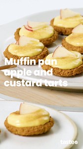Mini tarts, major crowd-pleaser. These bite-sized apple and custard tarts are made in a muffin pan using butternut snap biscuits, tinned apples and ready-made custard. They’re as easy as they are delicious! If you’d like this recipe, Google ‘Taste Muffin pan apple and custard tarts’. Recipe by @amira_georgy_ #appletarts #custardtarts #easybaking #quickdessert #partyfood | Taste.com.au