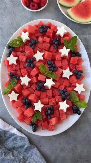 Ain’t Too Proud To Meg | Cheese, Charcuterie & More on Instagram: "⭐️❤️ SHARE ❤️⭐️this with someone you wanna celebrate with. COMMENT “july” & I’ll DM ya the cookie cutter and my favorite watermelon cutter. Directions ⬇️ This red, white and blue fruit plate is super easy and festive. Just cube watermelon, add blueberries and feta + mint. #ainttooproudtocheese To make it extra festive I made feta stars. ⭐️ with the feta blocks from Trader Joe’s because they’re the perfect size (each container has
