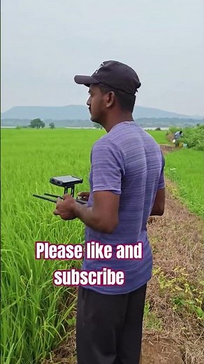 "Revolutionizing Agriculture: Watch This Farmer Use Drones to Spray Pesticides on Paddy Fields!"