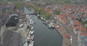 Aerial towards sailing boats moored in the historic Dutch town Enkhuizen in North Holland the Netherlands