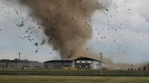 Video shows tornado ripping through homes, spraying debris