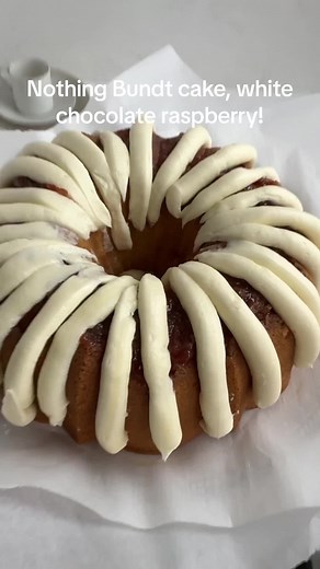 This copycat nothing Bundt cake is the white chocolate raspberry flavor! Make this recipe by clicking the link in my bio or going to www.cake-babe.com