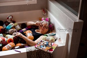 This Grandma Posed for a Sexy Photo Shoot in a Bathtub Full of Knitting Supplies