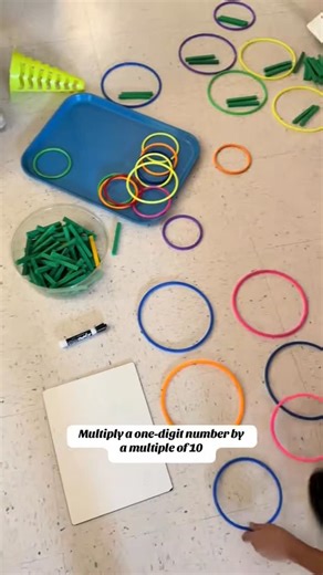 Andrea Powell on Instagram: "I absolutely LOVE a busy math classroom! Multiplying a 1-digit whole number by multiples of 10 is included in 3rd grade, Unit 3 in GA. This expectation is so easy to provide concrete practice! Pull out the base-ten rods, PV discs, even dimes or $10bills would work! #mathismyjam #teachersfollowteachers #mathisfun #elementarymath #iteachmath"