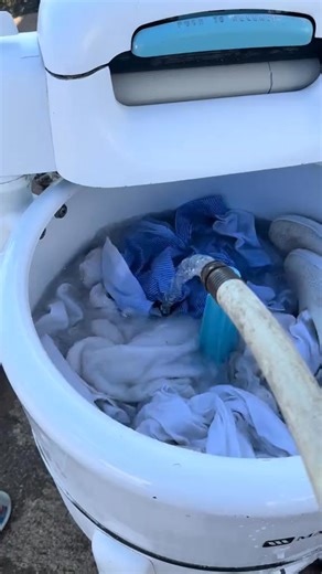 28K views · 526 reactions | Adding more water to the wringer washer. Mom had stained a pair of pants with coffee, so I’m curious to see if the stain will come out. Coffee is another scent that takes me back to my childhood. My parents drank coffee all year long. It is still one of Mom’s favorite things. #laundry #wringerwasher #kentucky #washday | Deeann York | Facebook